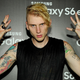 Illustration for article titled Watch Machine Gun Kelly dance on a boardroom table in front of some tired Interscope executives